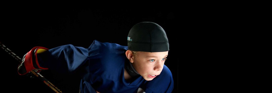 Child hockey player wearing Linx IAS